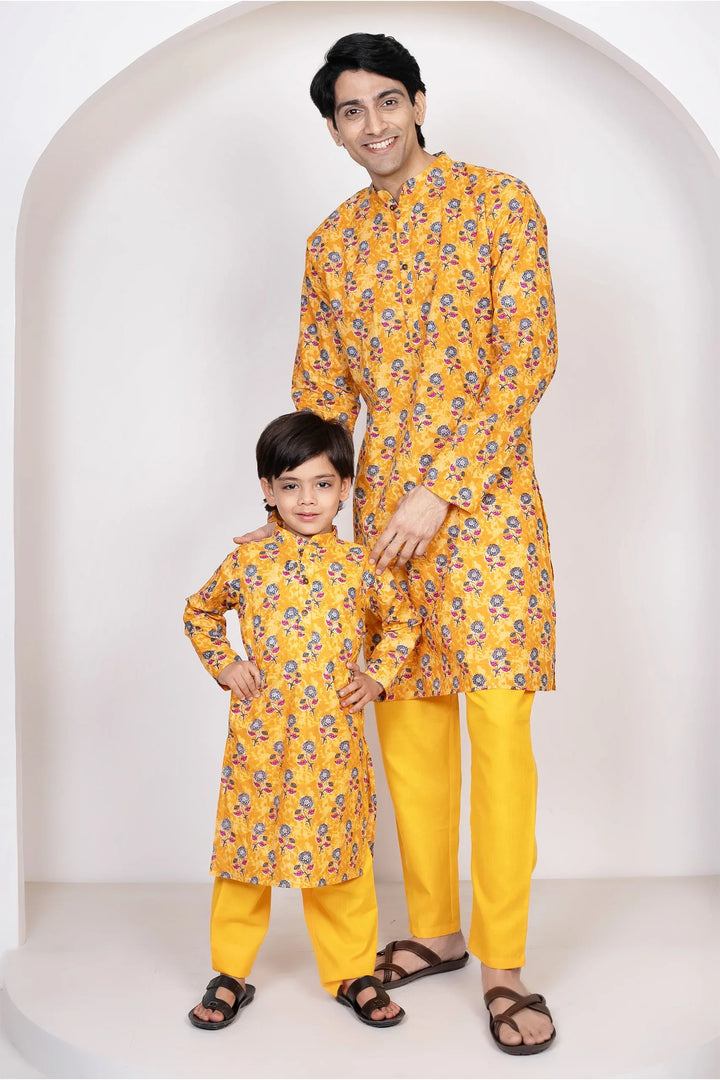Mustard Printed Lehenga Choli and Dupatta with Matching Kurta Pyjama Set for Family