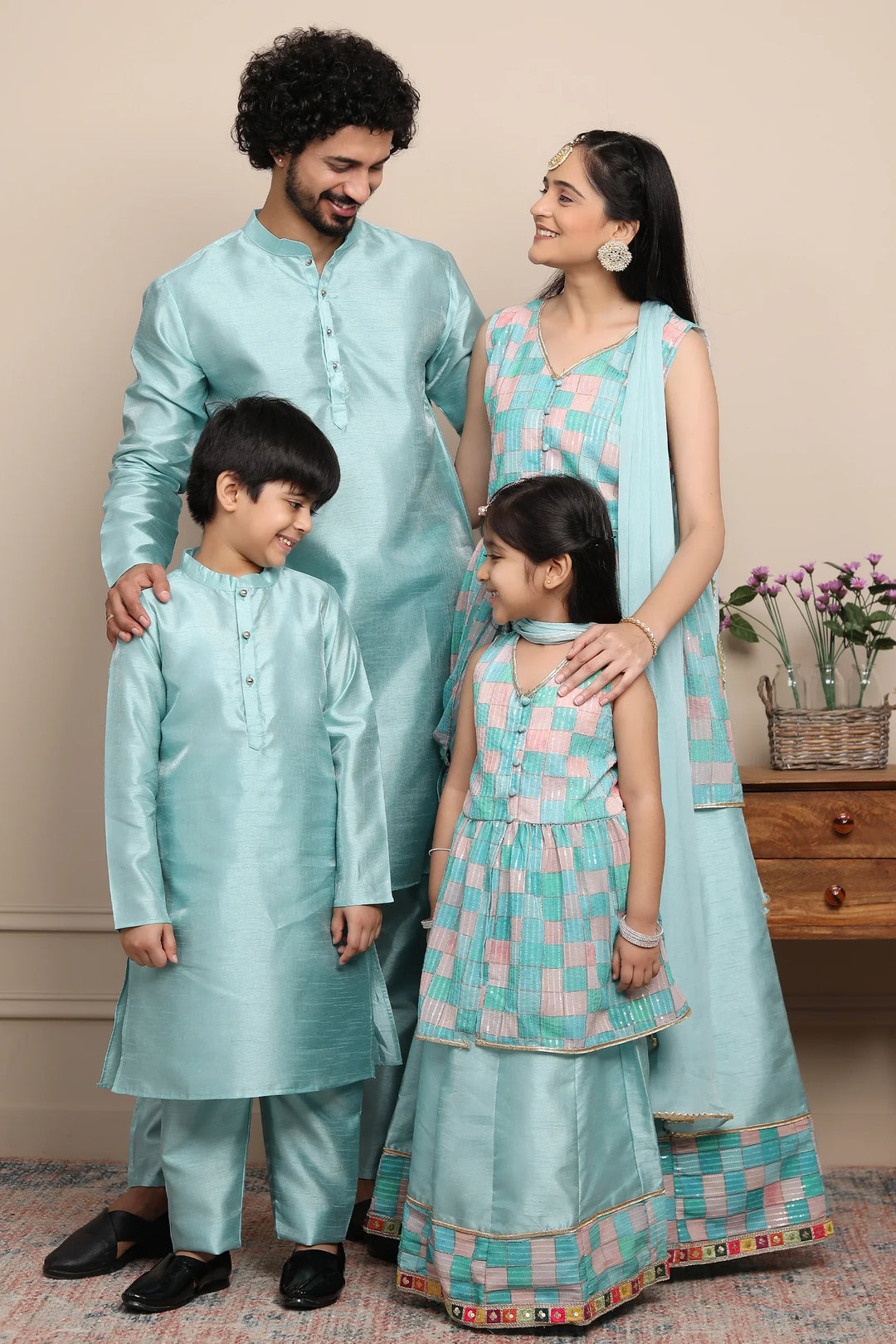 Shining Aqua Blue Lehenga and Peplum Top Set With Matching Kurta Pyjama for Family