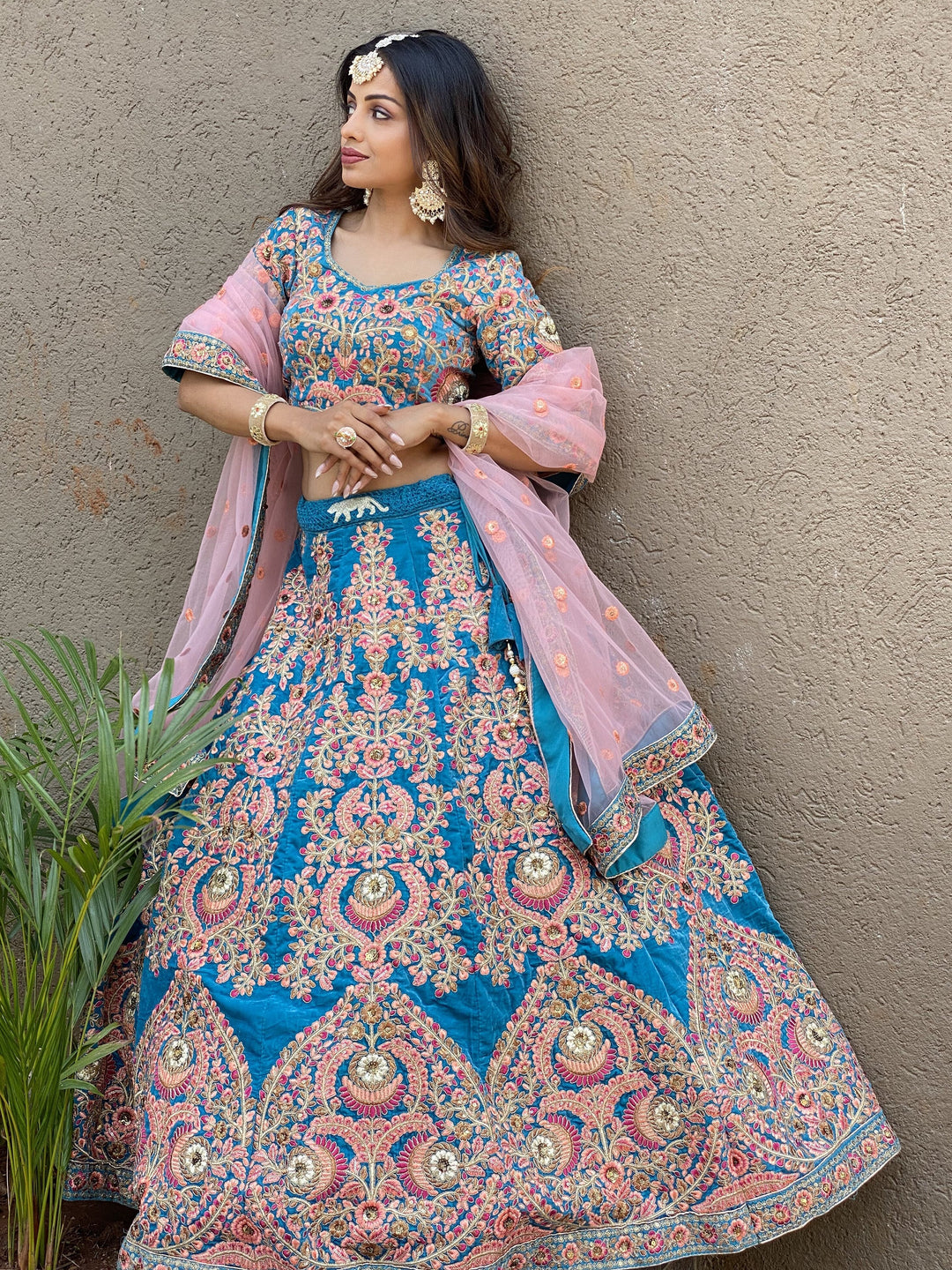 Attractive Blue Embroidered Velvet Wedding Wear Lehenga Choli