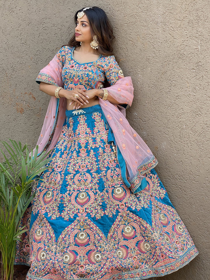 Attractive Blue Embroidered Velvet Wedding Wear Lehenga Choli