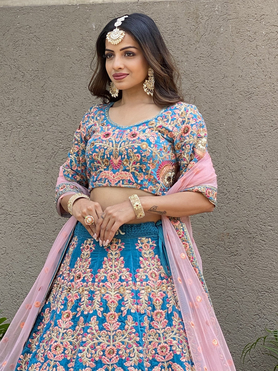 Attractive Blue Embroidered Velvet Wedding Wear Lehenga Choli