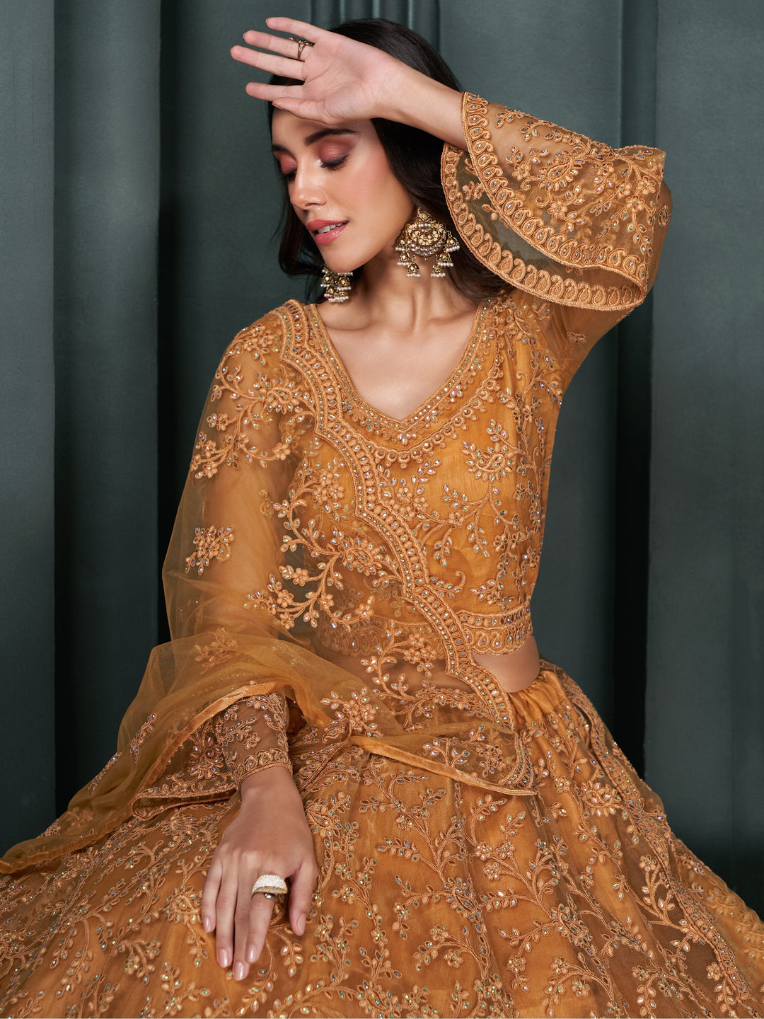 Fascinating Orange Thread Work Net Engagement Wear Lehenga Choli