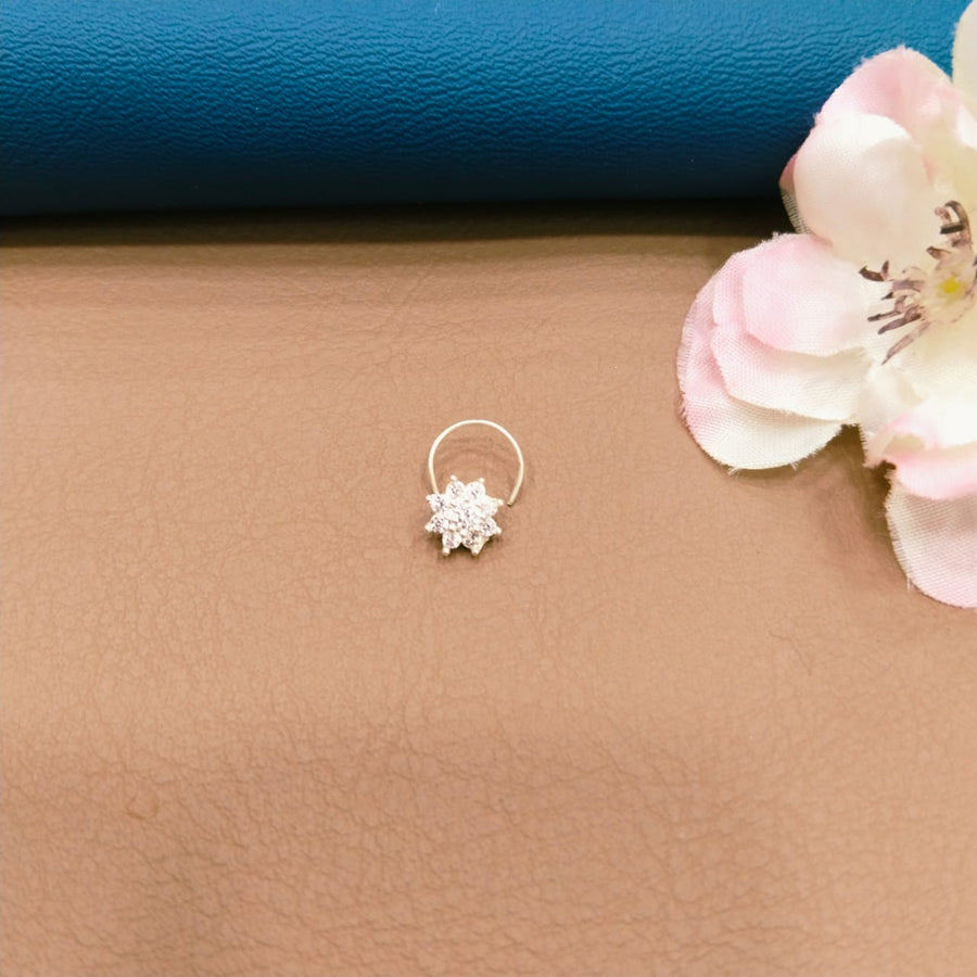 Trendy silver nose ring featuring floral motifs, perfect for festive celebrations.
