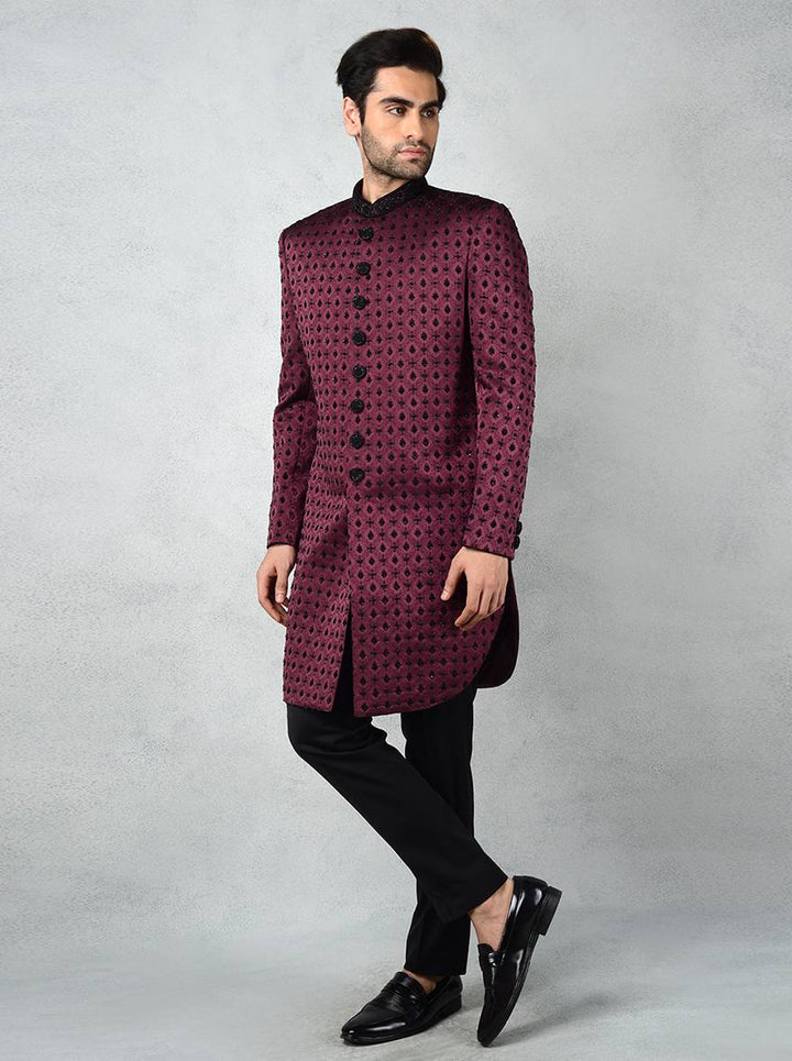 Traditional wine Indo Western kurta for men with hand embroidery and slim fit design.