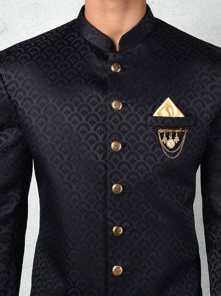 Traditional black Indo-Western wear for men with gold accents and modern design.