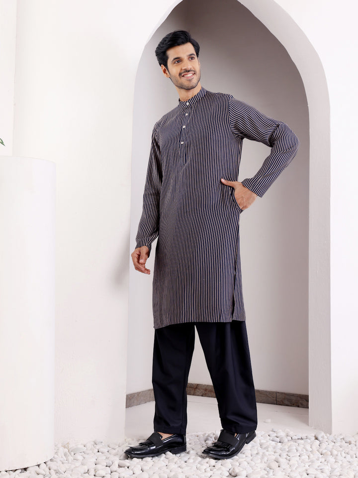 Traditional navy blue kurta set with embroidered details for men
