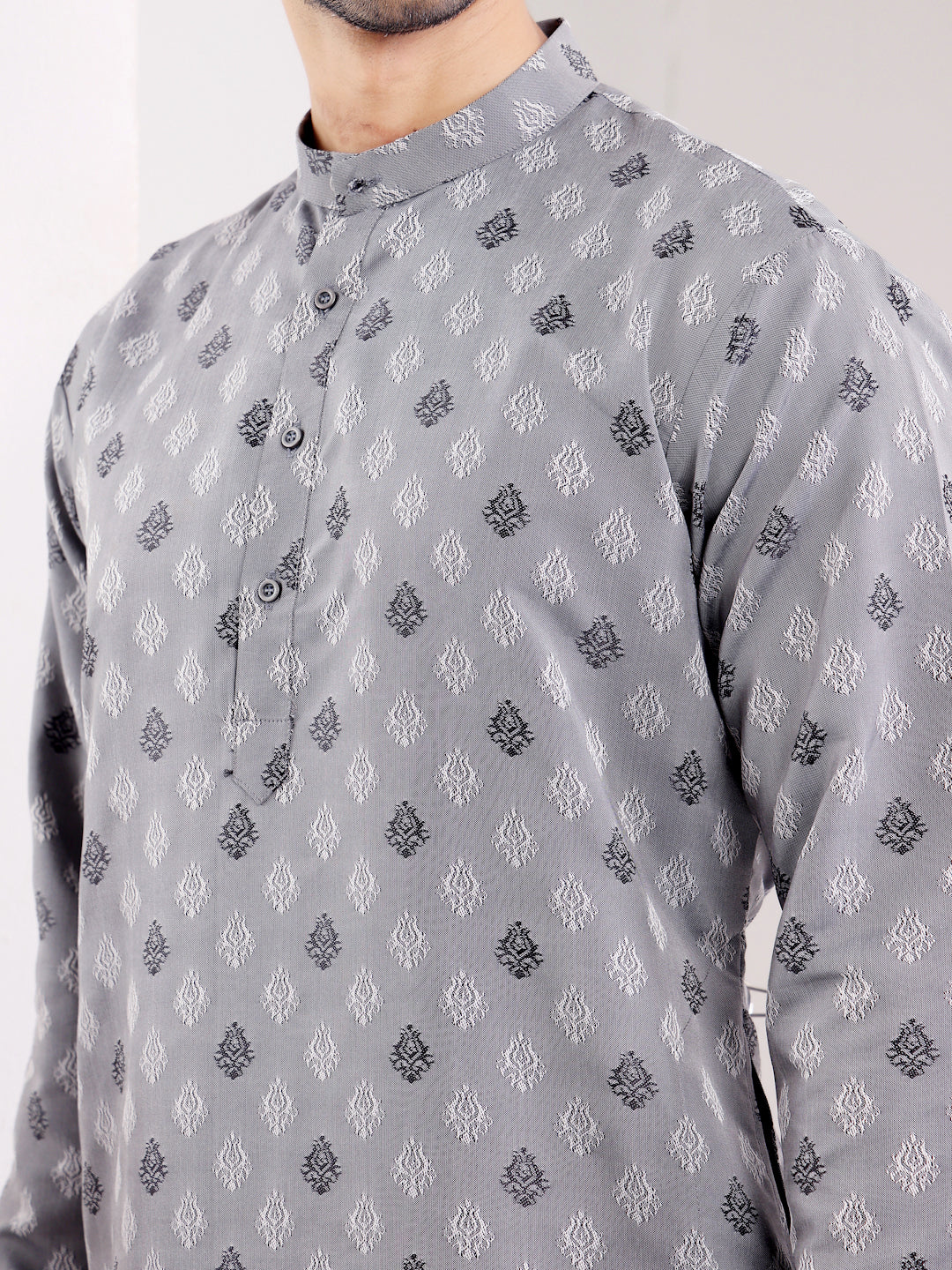 Classic gray kurta with fine handwoven detailing, perfect for a cultural celebration.