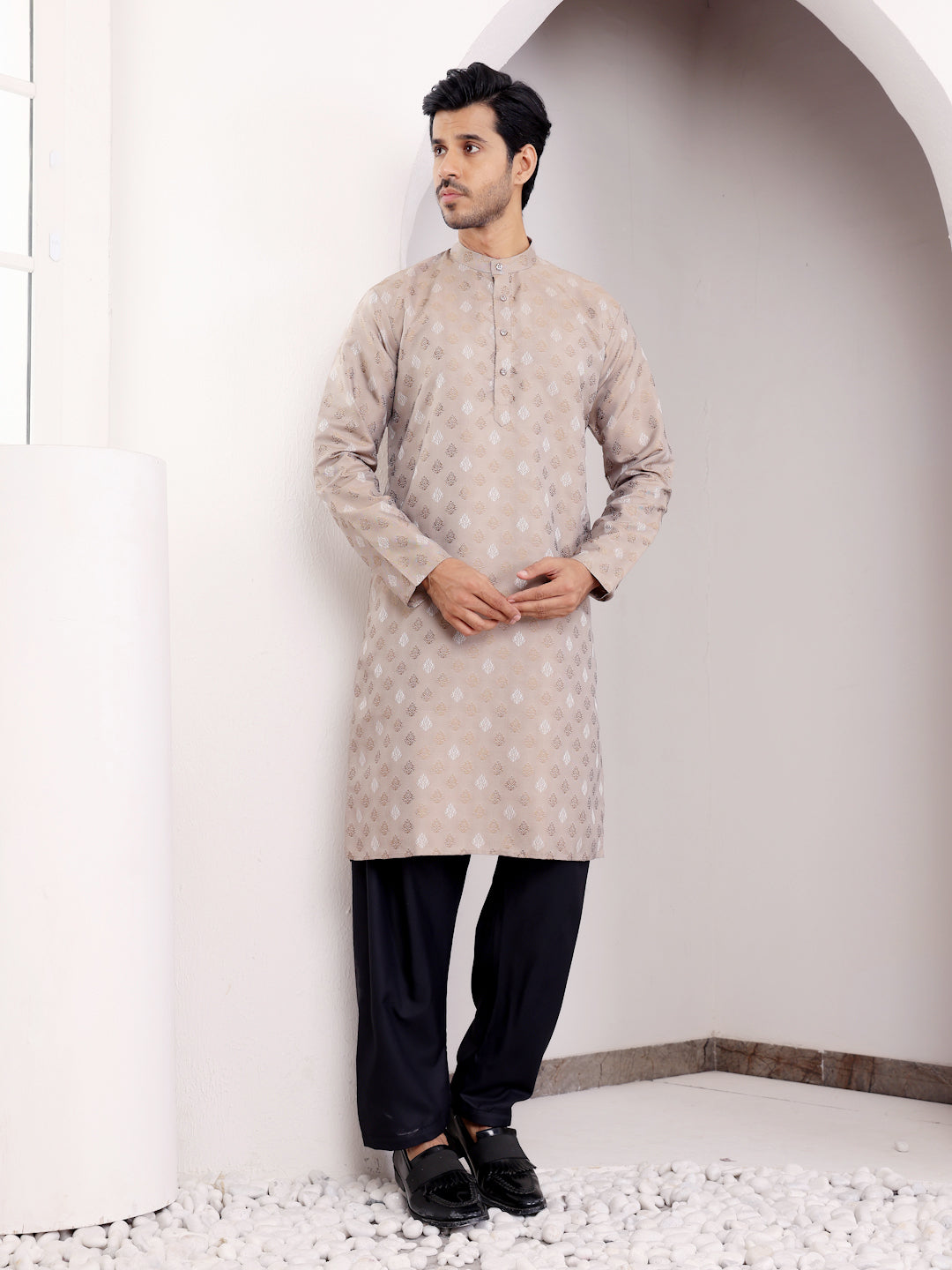 Modern light brown kurta featuring handwoven designs, adding a touch of tradition to a contemporary style.