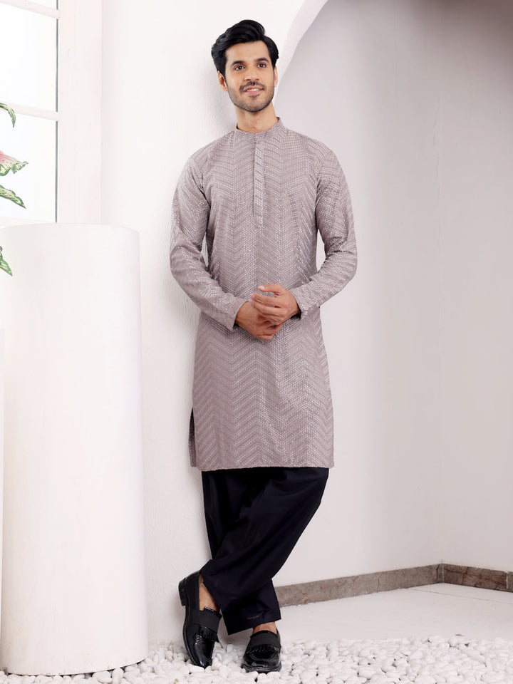 Dark grey kurta set for men with handwoven motifs and Chikankari embroidery, ideal for festive occasions.