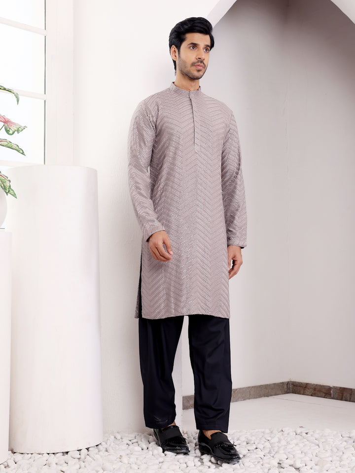 Festive dark grey kurta set with traditional Chikankari work and handwoven motifs for men.