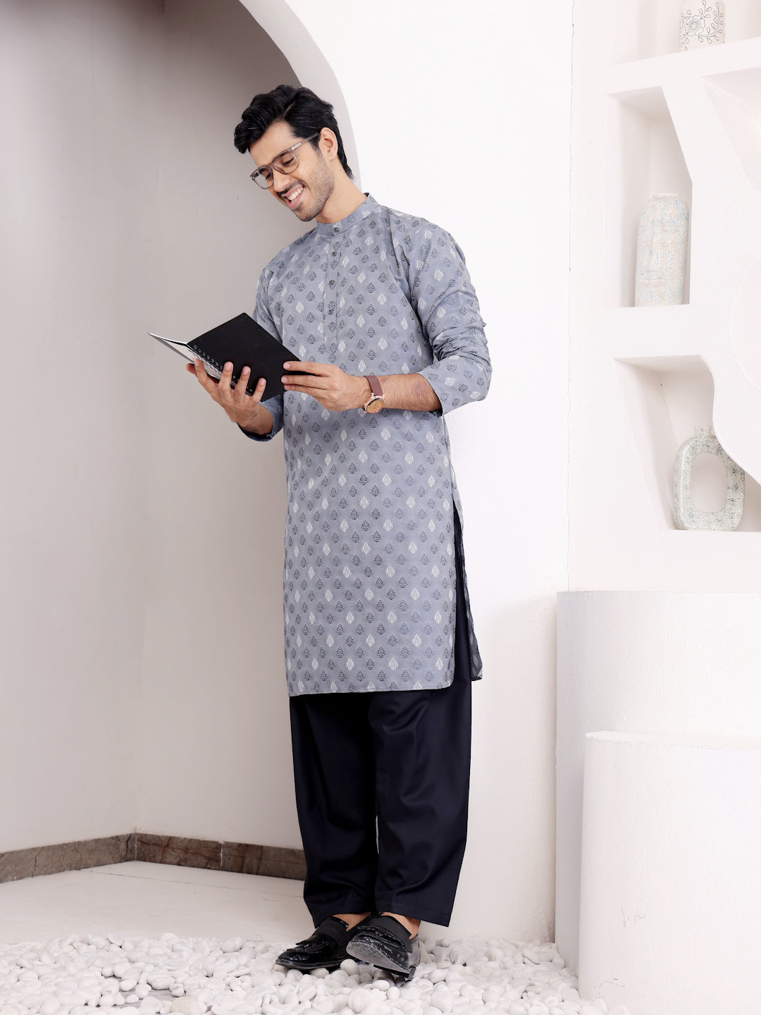 Contemporary light blue kurta set with detailed craftsmanship and a modern yet traditional touch.