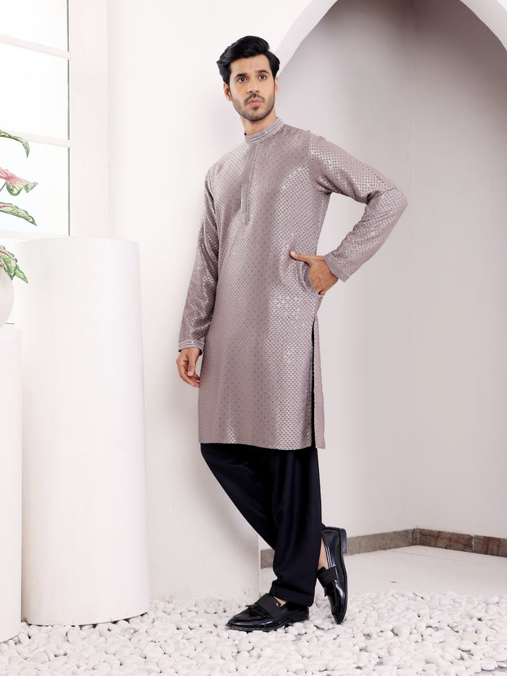 Men’s dark grey kurta set with elegant embroidery, ideal for festive occasions.