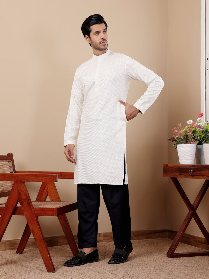 Classic white Viscose kurta set for men with Chikankari work and handwoven details.