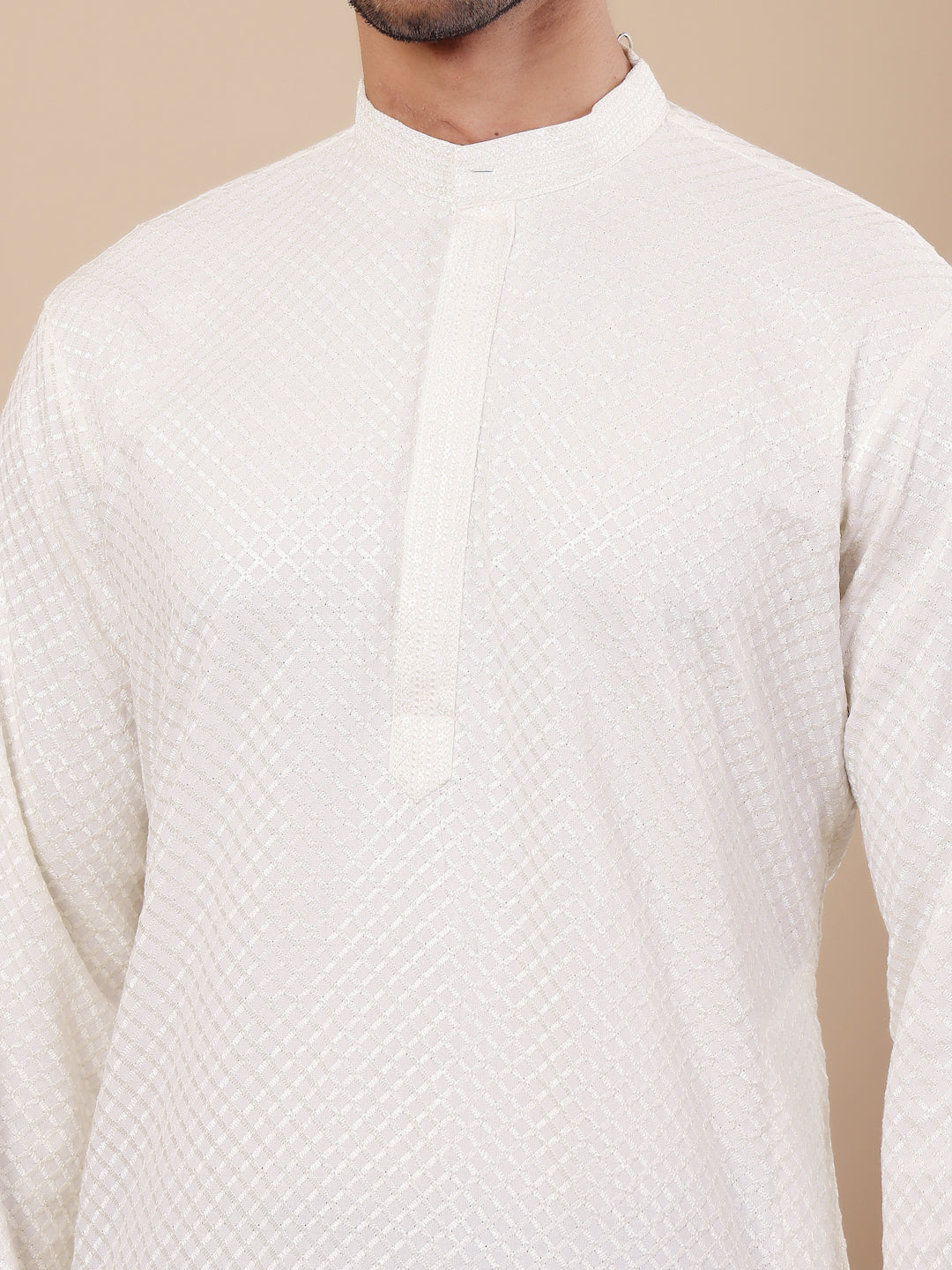 Men’s white kurta set made of Viscose fabric with delicate Chikankari embroidery and handwoven accents for an elegant appearance.