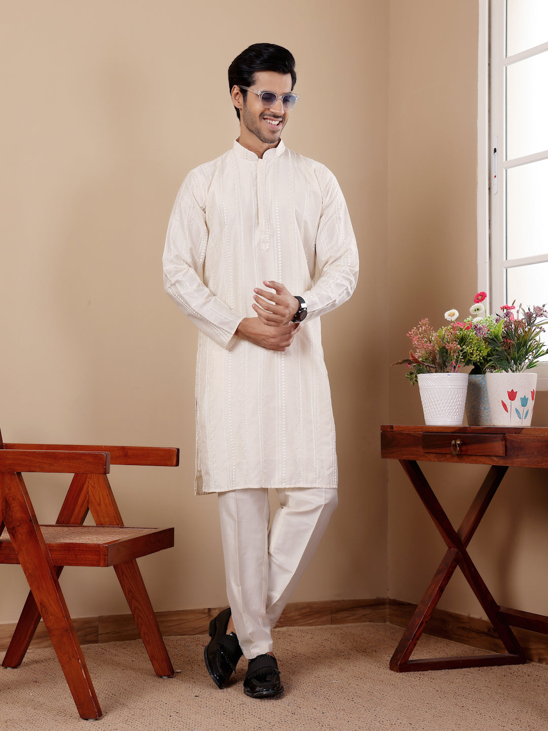 Sophisticated off-white cotton kurta set for men blending traditional artistry and comfort.