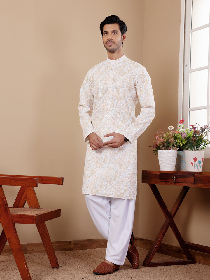 Men's ethnic wear in yellow featuring traditional chikankari embroidery and art silk pajama.