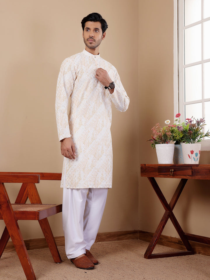 Stylish yellow tie-dye kurta pajama set for men, ideal for festivals and weddings.