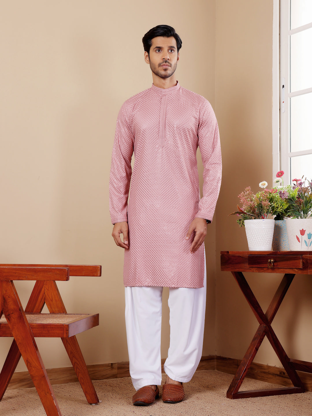 Men’s onion pink Viscose kurta featuring intricate Chikankari work and art silk bottoms.