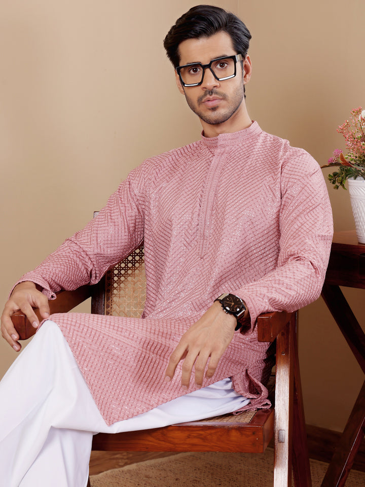 Elegant onion pink kurta with intricate Chikankari work and luxurious art silk bottoms, designed for men.