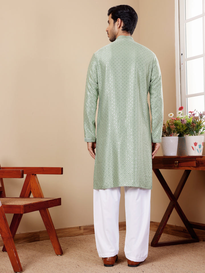 Elegant pastel green kurta with Chikankari detailing, perfect for any occasion.