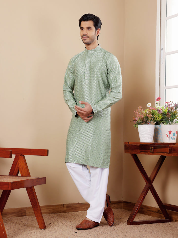 Traditional pastel green kurta for men with embroidery, perfect for festive occasions.