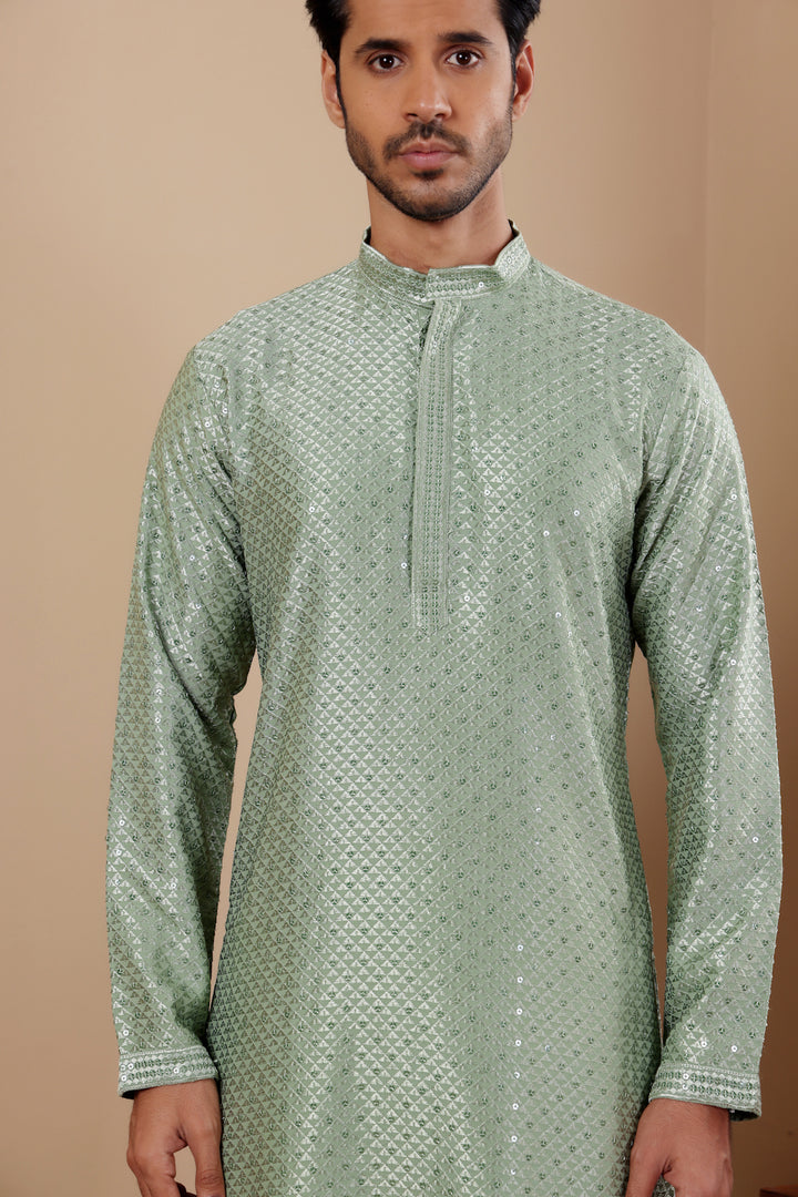 Comfortable pastel green kurta set with intricate Chikankari work and breathable fabric.
