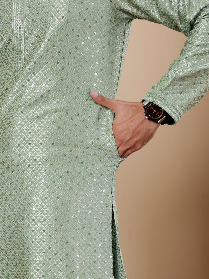 Pastel green kurta set with elegant Chikankari embroidery, perfect for cultural celebrations.