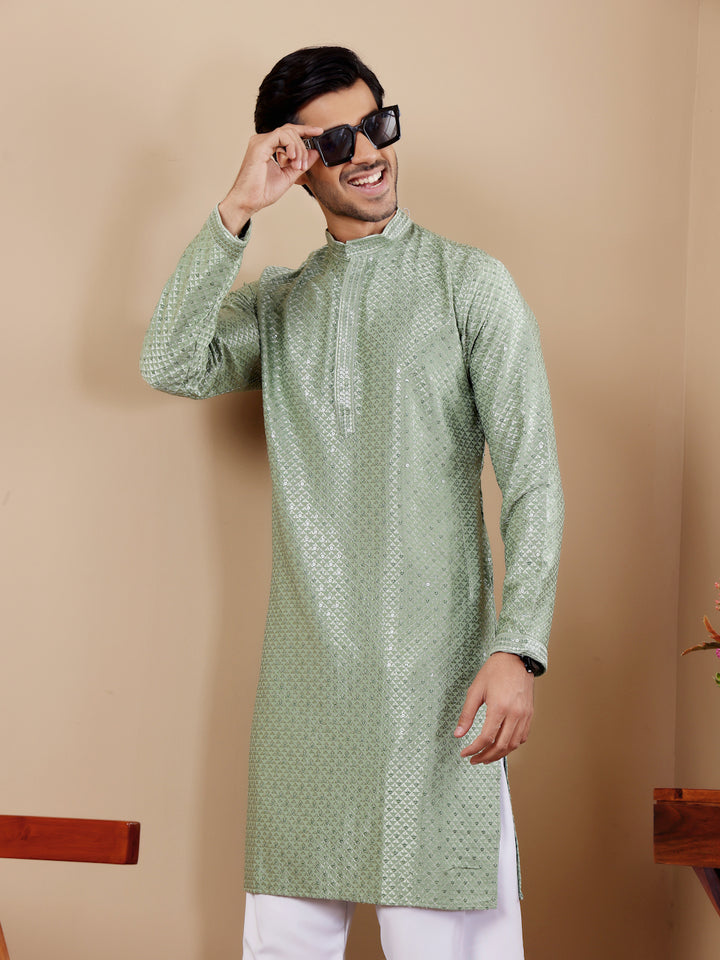 Pastel green kurta with fine Chikankari work and art silk bottoms for a sophisticated look.