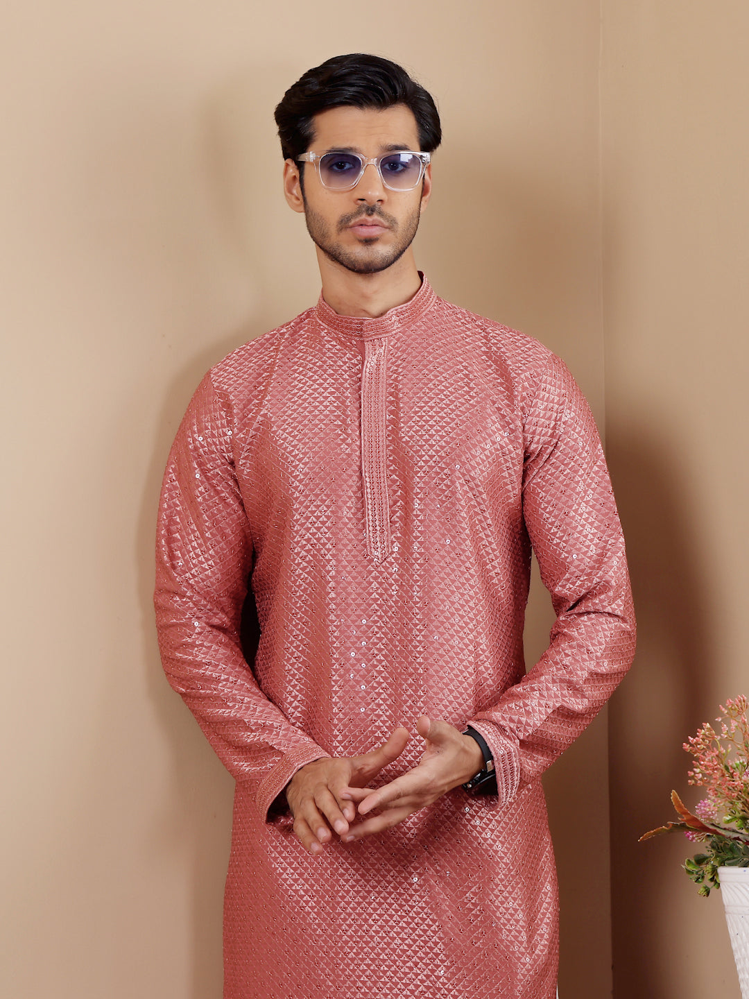 Comfortable pastel red kurta with Chikankari work, ideal for family gatherings.