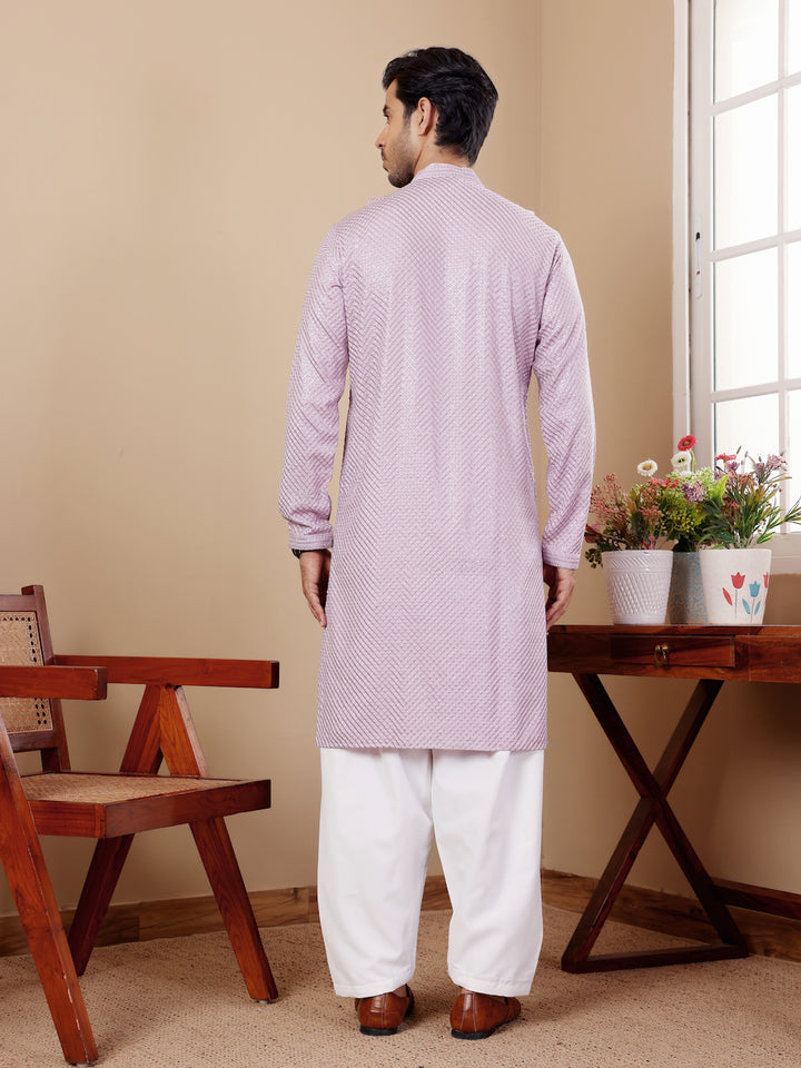 Lavender kurta set for men with Chikankari embroidery and art silk bottoms.