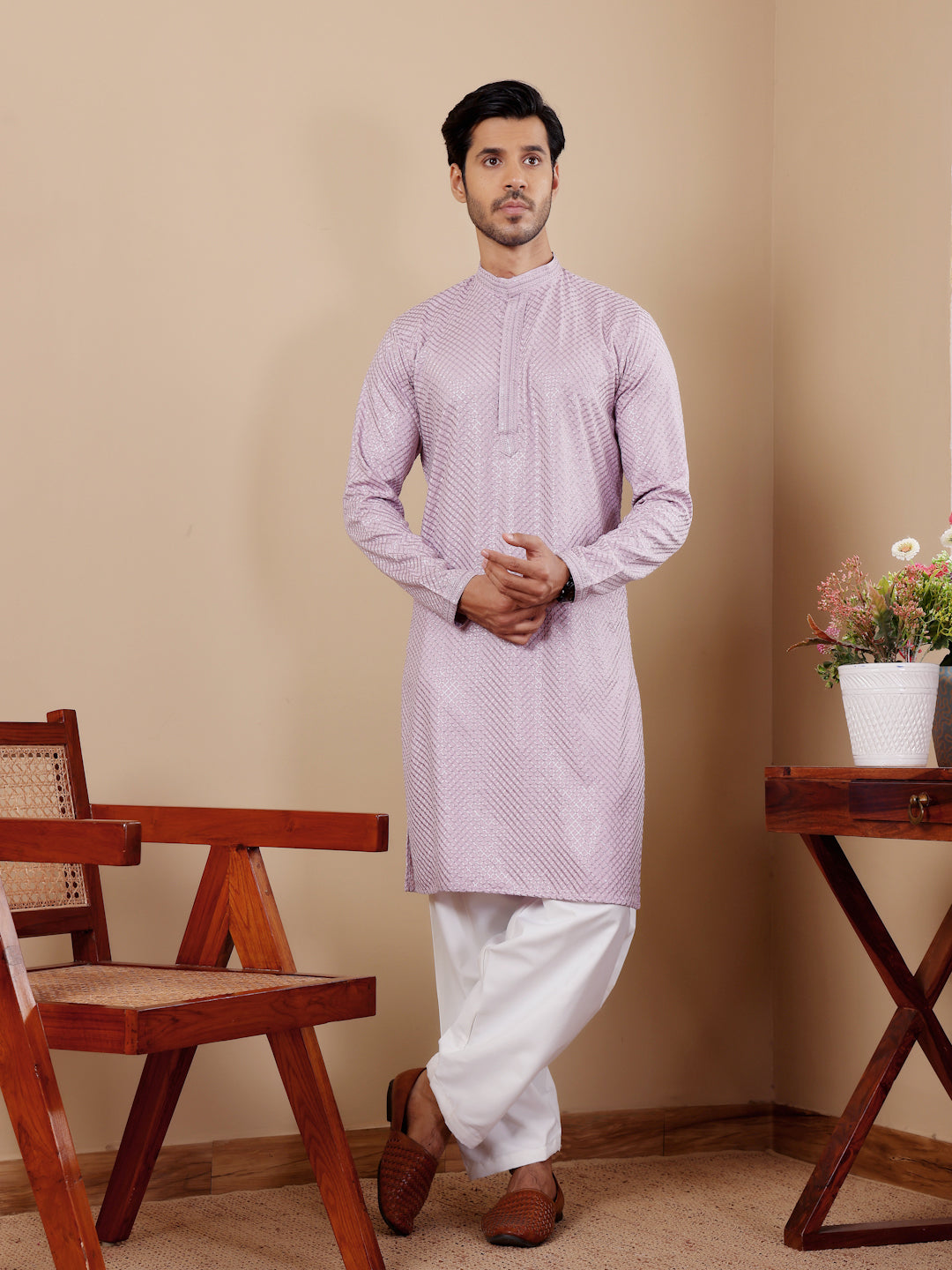 Elegant lavender Viscose kurta set featuring intricate Chikankari work and art silk bottoms.