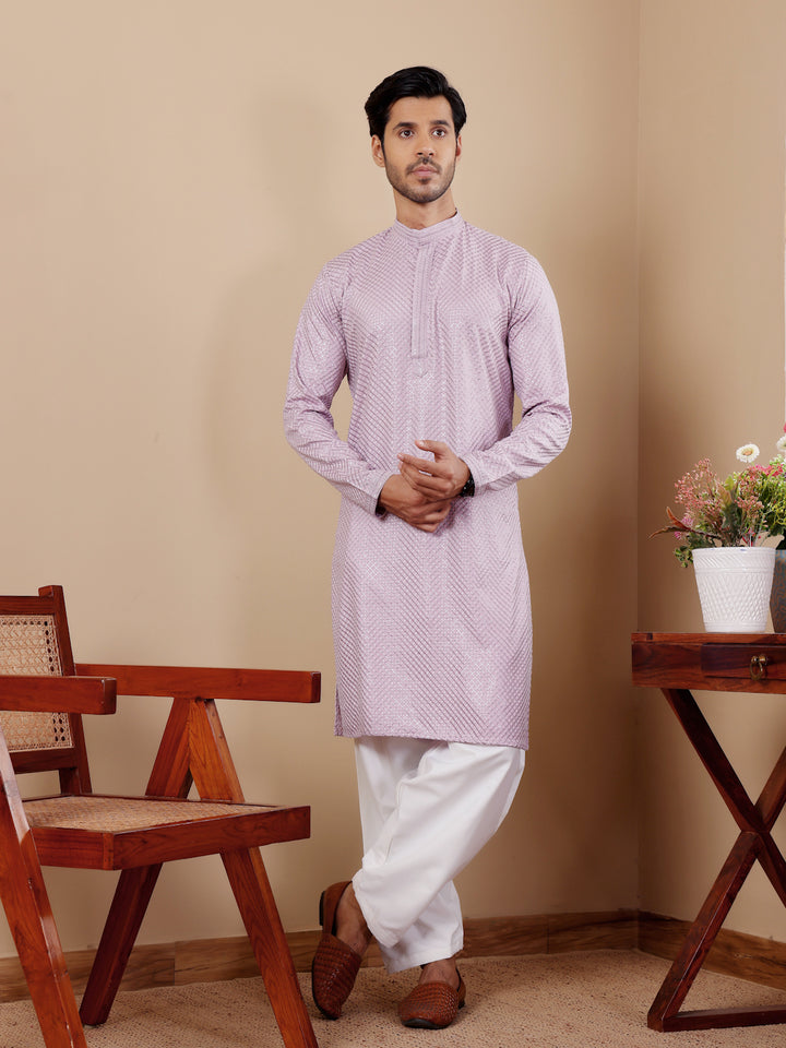 Elegant lavender Viscose kurta set featuring intricate Chikankari work and art silk bottoms.