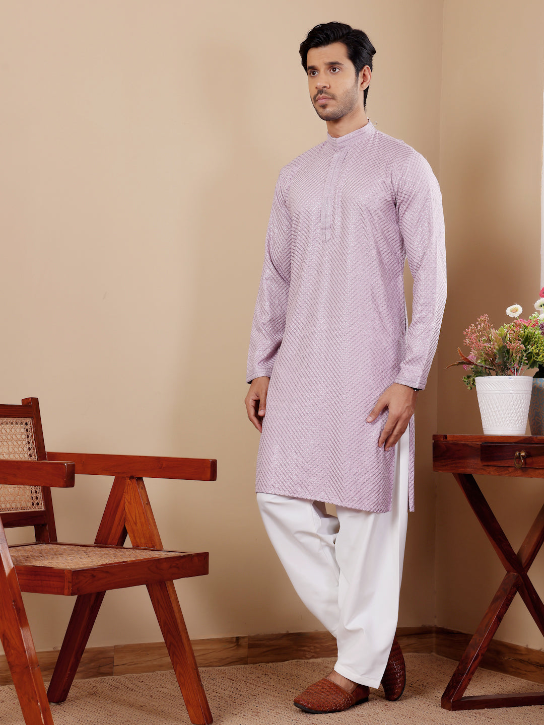 Men’s lavender kurta with delicate Chikankari embroidery and luxurious art silk bottoms.