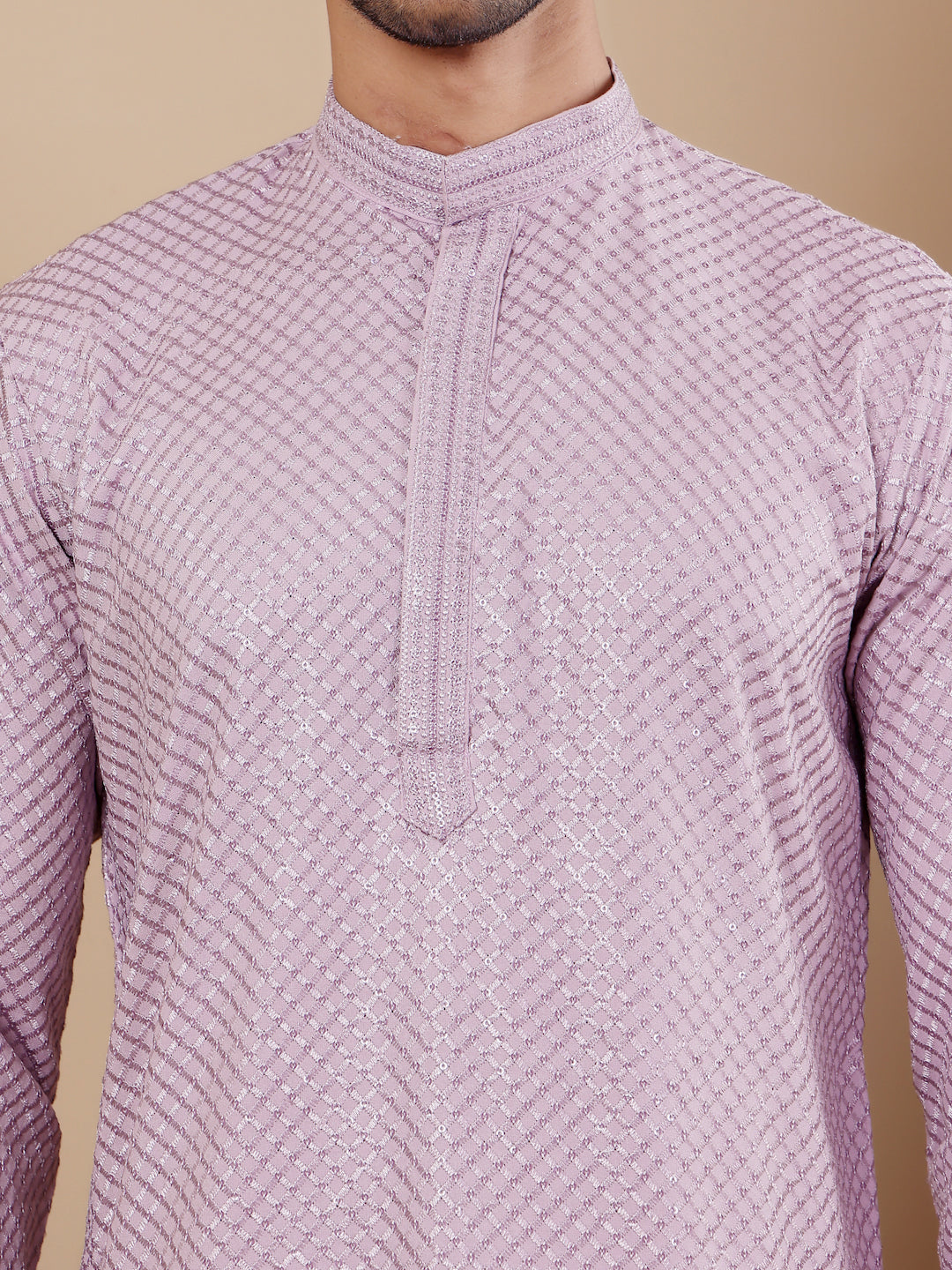Timeless lavender kurta for men featuring detailed Chikankari embroidery and soft art silk bottoms.