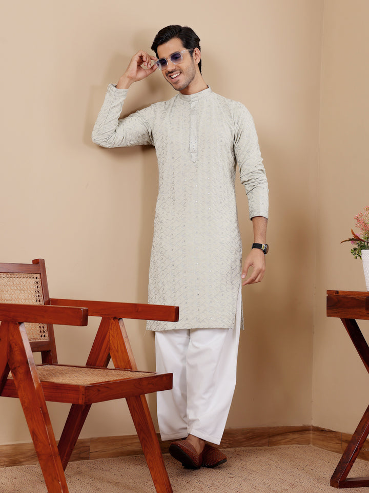 Sophisticated festive kurta pajama for men, crafted with intricate weaved details.