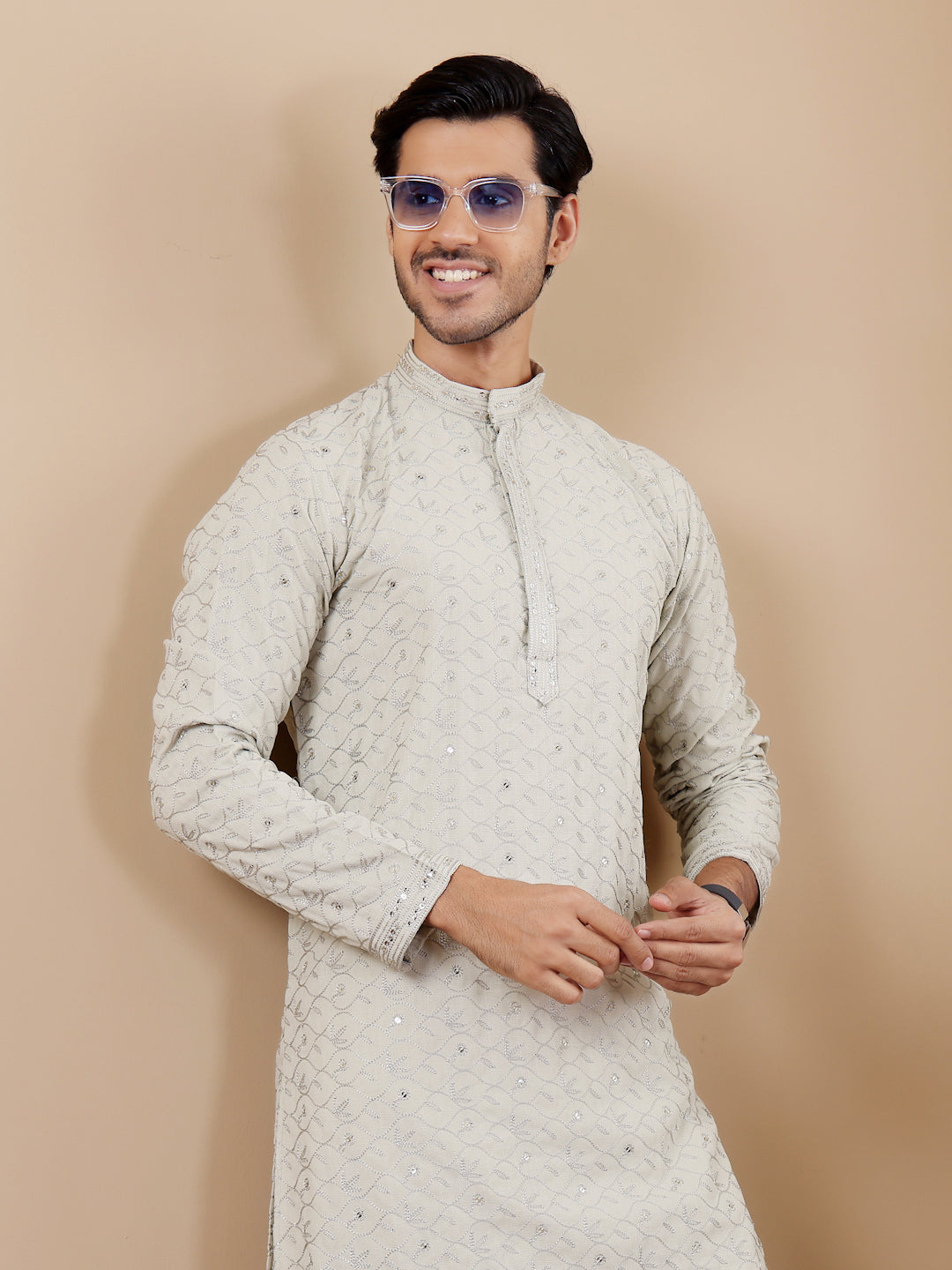 Traditional men's kurta with fine woven motifs, crafted for a luxurious festive feel.