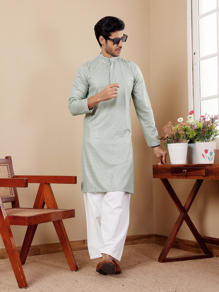 Luxurious light pastel green Viscose kurta with Chikankari embroidery and art silk bottoms.