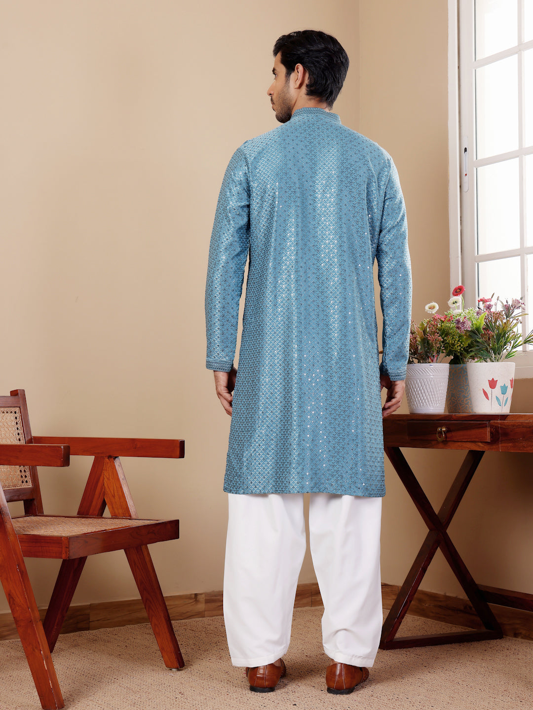 Elegant cyan blue kurta with Chikankari embroidery, perfect for festive occasions.