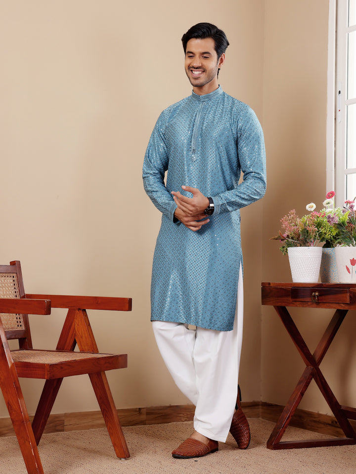 Traditional cyan blue kurta with Chikankari detailing, perfect for cultural events.