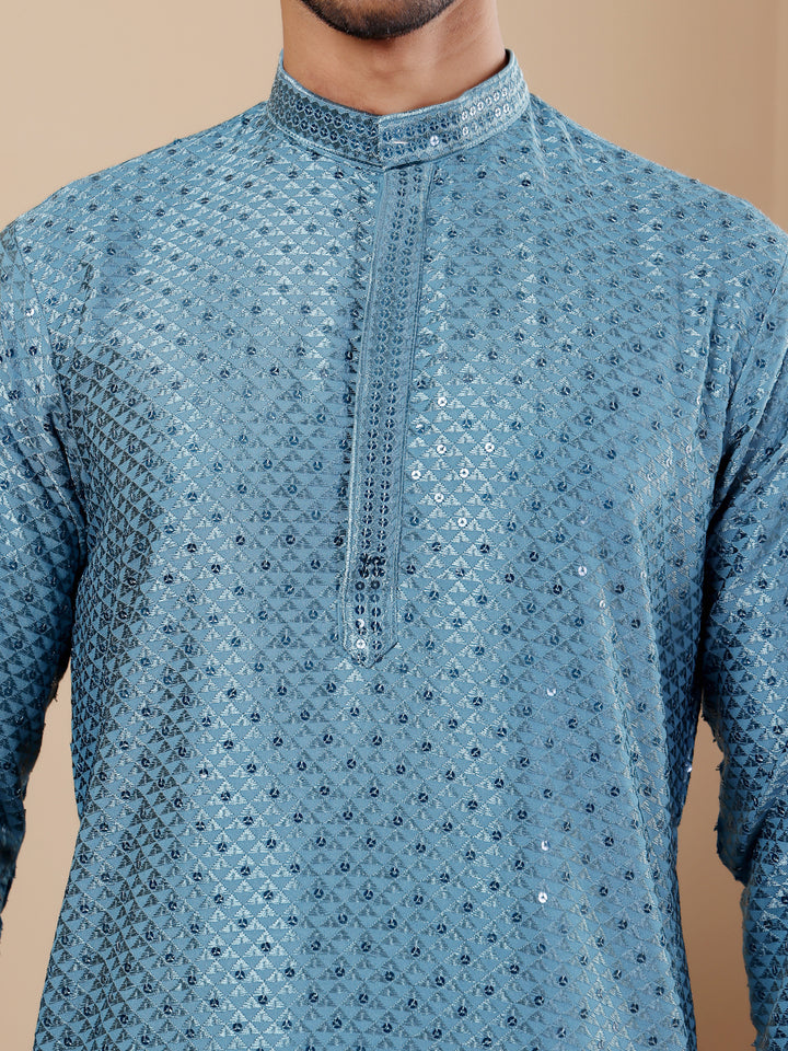 Comfortable cyan blue kurta for men with Chikankari work and breathable viscose fabric.