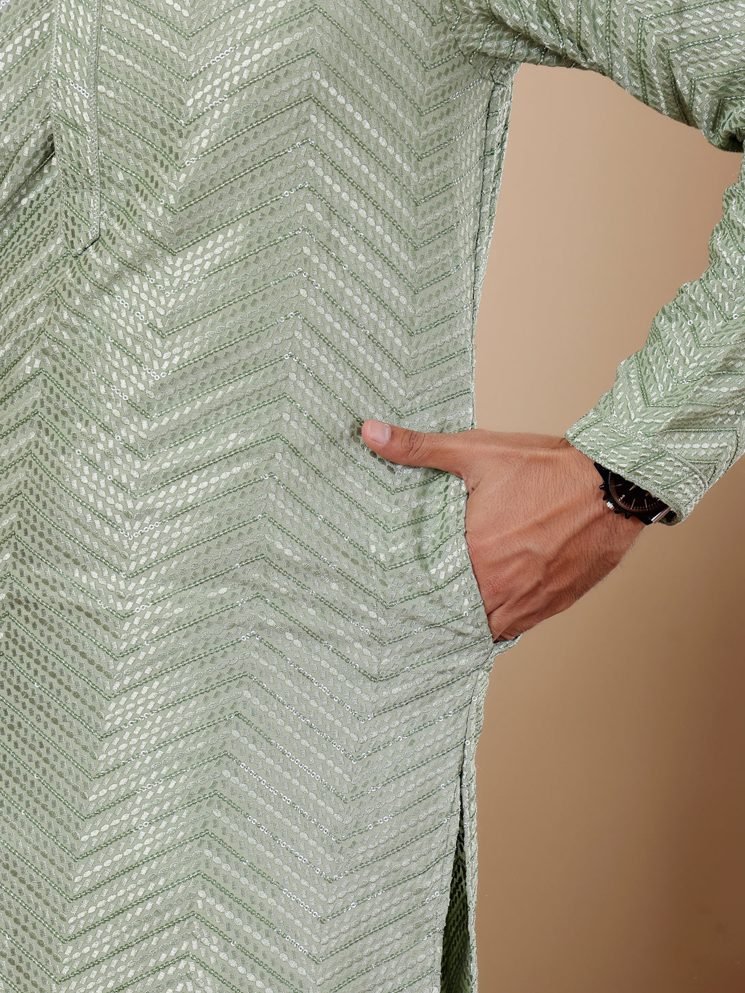 Festive pastel green kurta set with Chikankari embroidery and handwoven accents, designed for men.