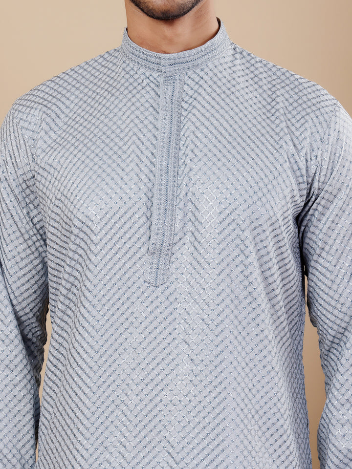 Men’s baby blue kurta with Chikankari embroidery and art silk bottoms, perfect for festive occasions.