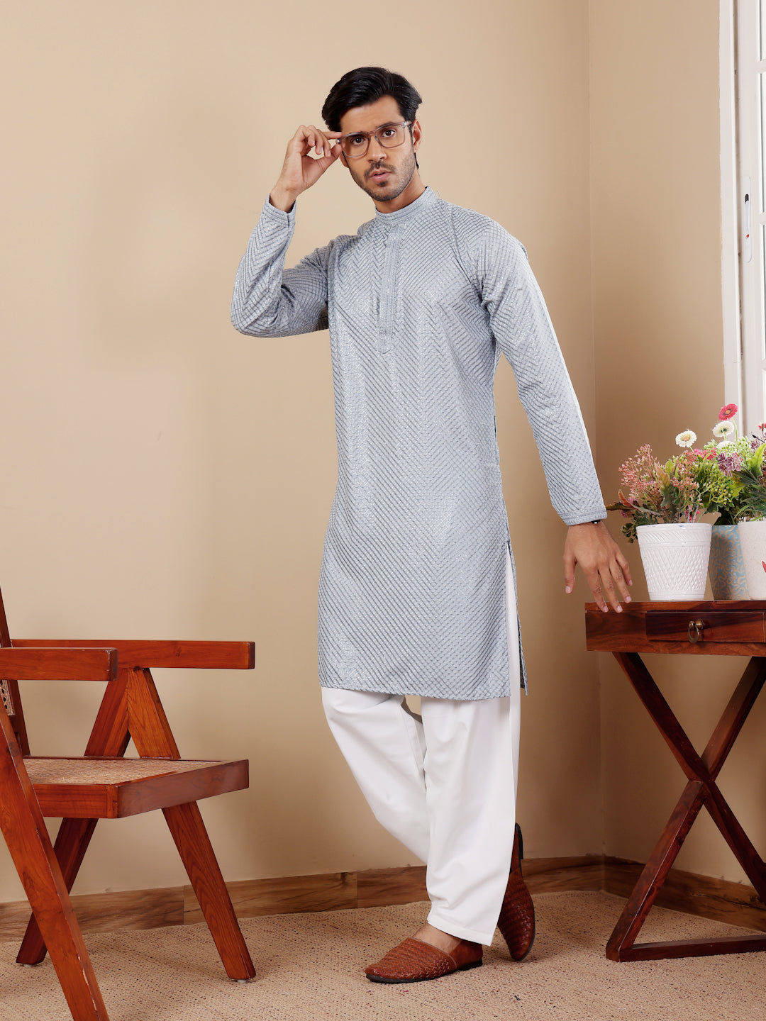 Sophisticated baby blue Viscose kurta set for men with intricate handwoven motifs and art silk bottoms.