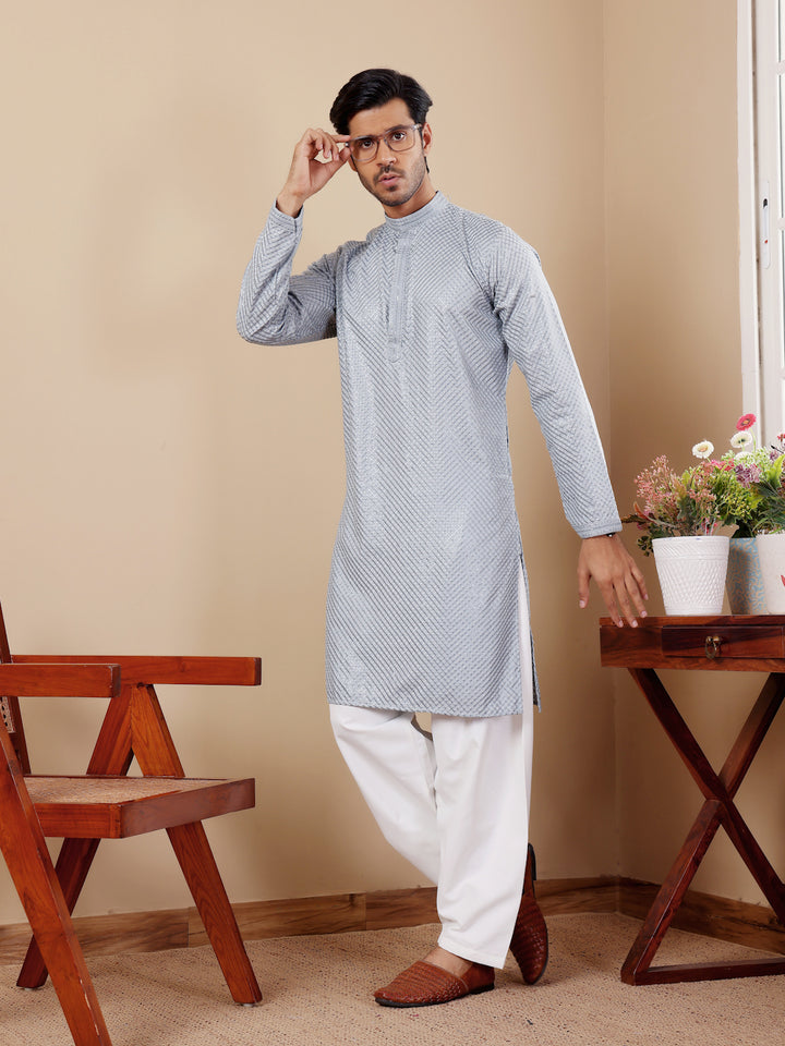 Sophisticated baby blue Viscose kurta set for men with intricate handwoven motifs and art silk bottoms.