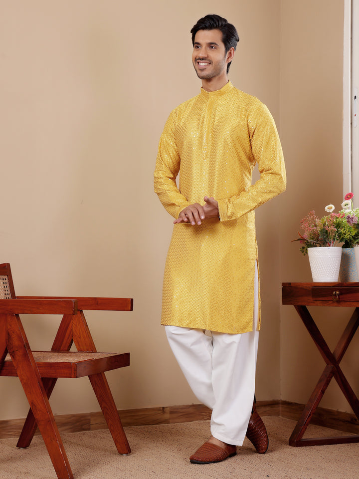 Men’s yellow kurta with Chikankari embroidery, perfect for traditional celebrations.