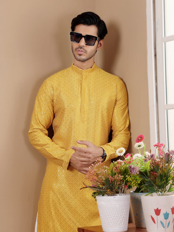 Traditional yellow kurta set featuring Chikankari work, ideal for any festive occasion.
