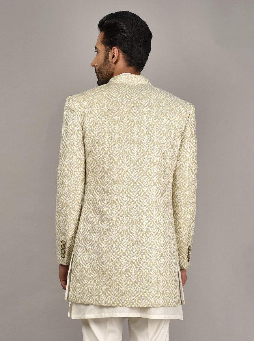 Classic jodhpuri suit in mehndi green with button embellishments.