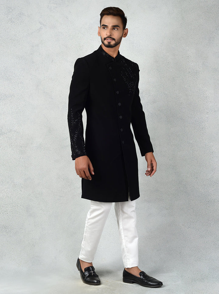 Black Indo-Western dress for men with resham and cutdana embroidery, combining tradition and style.