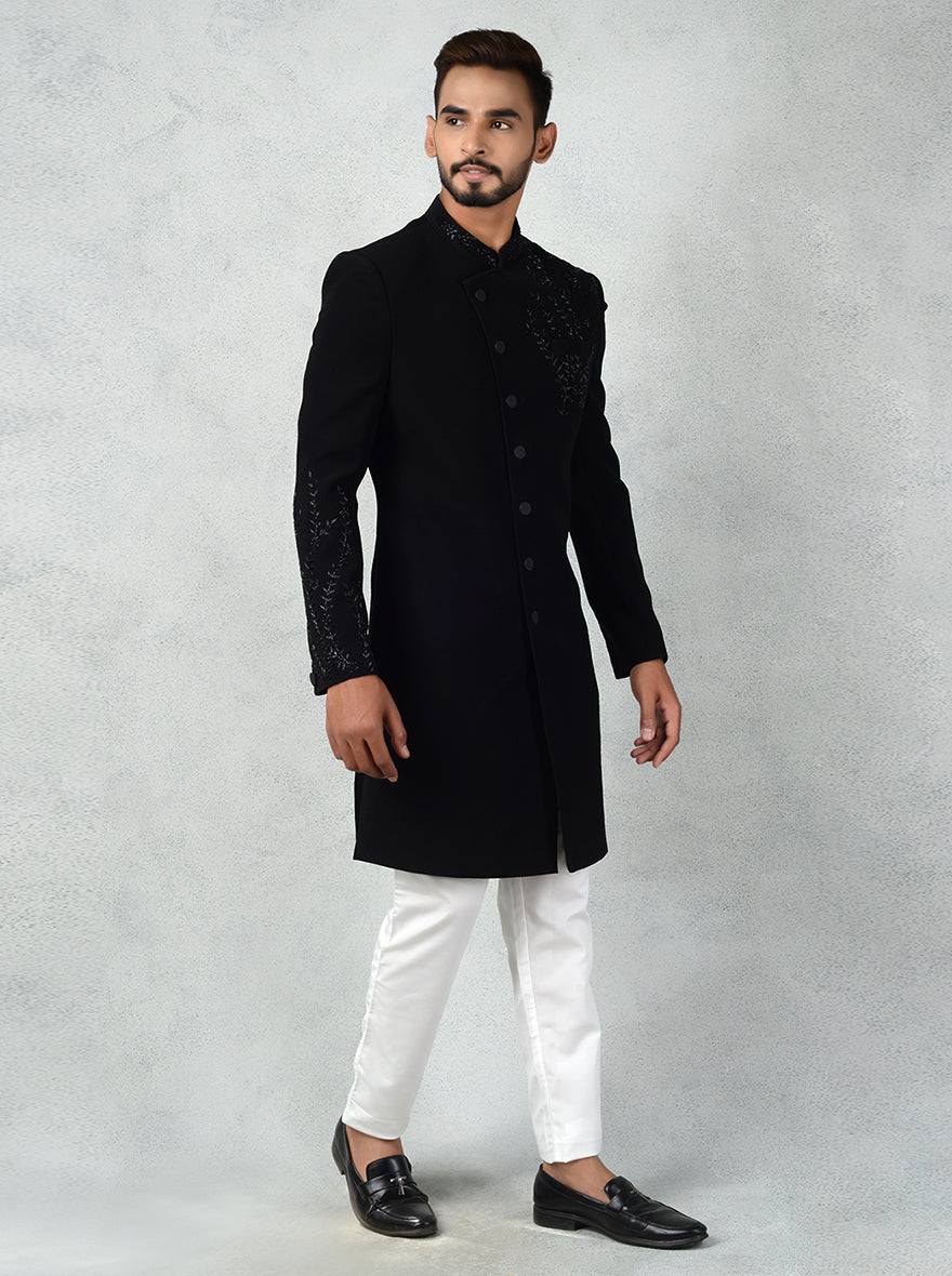 Black Indo-Western dress for men with resham and cutdana embroidery, combining tradition and style.