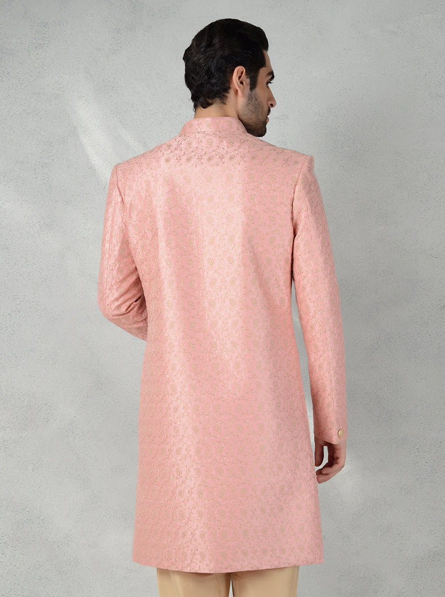 Stylish pink Indo-Western kurta for men, perfect for grooms, featuring intricate gold embroidery.